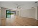 Bright Gathering room with hardwood floors and access to the pool area at 9511 Tequila Sunrise Dr, Sarasota, FL 34241
