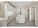 Spa-like bathroom with soaking tub and walk-in shower at 9511 Tequila Sunrise Dr, Sarasota, FL 34241