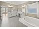 Large main bathroom with soaking tub and double vanity at 9511 Tequila Sunrise Dr, Sarasota, FL 34241