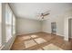 Main bedroom with hardwood floors and ensuite bathroom at 9511 Tequila Sunrise Dr, Sarasota, FL 34241