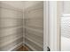 Walk-in pantry with ample shelving for storage at 9511 Tequila Sunrise Dr, Sarasota, FL 34241