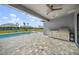 Outdoor kitchen and pool with patio and a fountain at 9511 Tequila Sunrise Dr, Sarasota, FL 34241