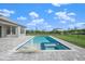 Inviting rectangular pool with integrated spa and water feature at 9511 Tequila Sunrise Dr, Sarasota, FL 34241