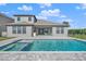 Home with inviting pool and spa, spacious patio, and outdoor kitchen at 9511 Tequila Sunrise Dr, Sarasota, FL 34241