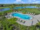 Community resort-style pool with lounge chairs at 9511 Tequila Sunrise Dr, Sarasota, FL 34241
