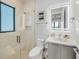 Modern bathroom with glass shower, floating vanity, and sleek fixtures at 101 7Th S St, Bradenton Beach, FL 34217