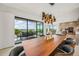 Ocean view dining room with modern wood table and chairs at 101 7Th S St, Bradenton Beach, FL 34217