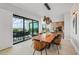Ocean view dining room with modern wood table and chairs at 101 7Th S St, Bradenton Beach, FL 34217