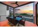 Oceanfront patio with dining table for six at 101 7Th S St, Bradenton Beach, FL 34217