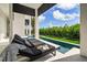 Relaxing patio with pool and lounge chairs at 101 7Th S St, Bradenton Beach, FL 34217