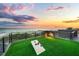 Relaxing rooftop deck with ocean views and cornhole at 101 7Th S St, Bradenton Beach, FL 34217