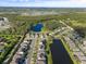 Aerial view of community near a lake at 1021 Fernleaf Run, Bradenton, FL 34212