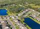 Community overview with lake and homes at 1021 Fernleaf Run, Bradenton, FL 34212