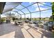 Spacious screened-in patio overlooking a lake at 1021 Fernleaf Run, Bradenton, FL 34212
