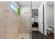 Spa-like bathroom with walk-in shower, pebble floor, and modern vanity at 1021 Fernleaf Run, Bradenton, FL 34212