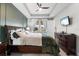 Spacious bedroom with dark wood furniture and a large window at 1021 Fernleaf Run, Bradenton, FL 34212