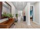 Bright and spacious entryway with hardwood floors and a view into the living room at 1021 Fernleaf Run, Bradenton, FL 34212