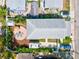 House with circular fire pit, lush landscaping, and RV parking at 1110 12Th W St, Bradenton, FL 34205