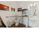 Clean and functional bathroom with toilet, sink, and grab bar at 1110 12Th W St, Bradenton, FL 34205