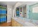 Modern bathroom with double vanity and light blue tile at 1110 12Th W St, Bradenton, FL 34205