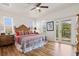 Large bedroom with wood floors and access to a private balcony at 1110 12Th W St, Bradenton, FL 34205