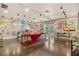 Spacious art-filled gallery with hardwood floors and track lighting at 1110 12Th W St, Bradenton, FL 34205