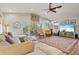 Spacious living room with vaulted ceilings, hardwood floors, and comfy seating at 1110 12Th W St, Bradenton, FL 34205