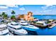Aerial view of a marina with yachts and waterfront restaurant at 1110 12Th W St, Bradenton, FL 34205