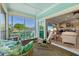 Relaxing screened porch with wicker furniture and view of the street at 1110 12Th W St, Bradenton, FL 34205