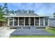 Charming home with a screened porch, deck, putting green, and fire pit at 1213 5Th W St, Palmetto, FL 34221
