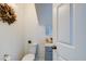 Small, modern powder room with gray vanity at 1213 5Th W St, Palmetto, FL 34221