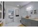 Modern bathroom with double vanity, updated fixtures, and a view of the bedroom at 1213 5Th W St, Palmetto, FL 34221