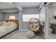 Main bedroom with king-size bed and stylish chair at 1213 5Th W St, Palmetto, FL 34221