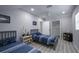 Bright bedroom with twin beds, ample closet space, and nautical-themed decor at 1213 5Th W St, Palmetto, FL 34221