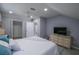 Main bedroom with a queen bed and a TV at 1213 5Th W St, Palmetto, FL 34221
