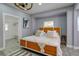 Main bedroom with king bed and ensuite access at 1213 5Th W St, Palmetto, FL 34221