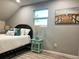 Relaxing bedroom with a queen-size bed and stylish decor at 1213 5Th W St, Palmetto, FL 34221