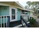 Front entrance with white door and black railings at 1213 5Th W St, Palmetto, FL 34221