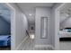 Upstairs hallway with light grey walls and wood-look flooring at 1213 5Th W St, Palmetto, FL 34221
