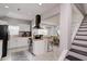 Open kitchen features island, stainless steel appliances, and white cabinetry at 1213 5Th W St, Palmetto, FL 34221