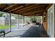 Covered porch with seating area and view of backyard at 1213 5Th W St, Palmetto, FL 34221