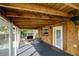Relaxing screened porch with seating area and ceiling fans at 1213 5Th W St, Palmetto, FL 34221