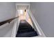 Black stairs leading to the lower level of the home at 1213 5Th W St, Palmetto, FL 34221