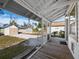 Screened porch overlooks backyard, sheds and driveway at 1302 18Th W St, Bradenton, FL 34205