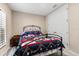 Cozy bedroom with a metal bed frame and ample closet space at 13330 Palmera Vista Dr, Riverview, FL 33579