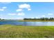 Stunning view of a serene lake with lush greenery at 13330 Palmera Vista Dr, Riverview, FL 33579