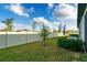 Landscaped backyard with a fenced perimeter at 14350 Easy Goer St, Ruskin, FL 33573