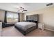 Main bedroom with large bed and window seat at 14350 Easy Goer St, Ruskin, FL 33573