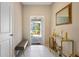 Bright and airy entryway with decorative console table and bench at 14350 Easy Goer St, Ruskin, FL 33573