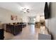 Open concept living room with stylish furniture and kitchen access at 14350 Easy Goer St, Ruskin, FL 33573